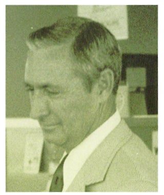 older sepia photo of man in a suit